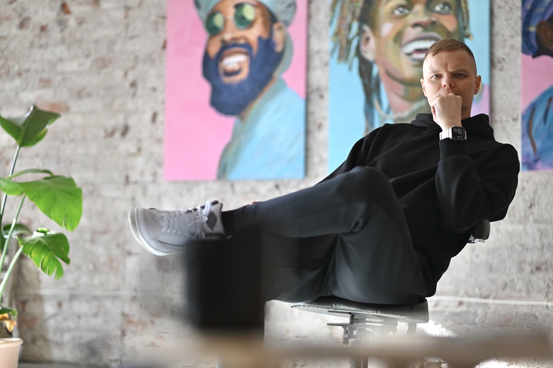 Tarczyn$ky in his Wrocław studio, standing beside an unfinished painting